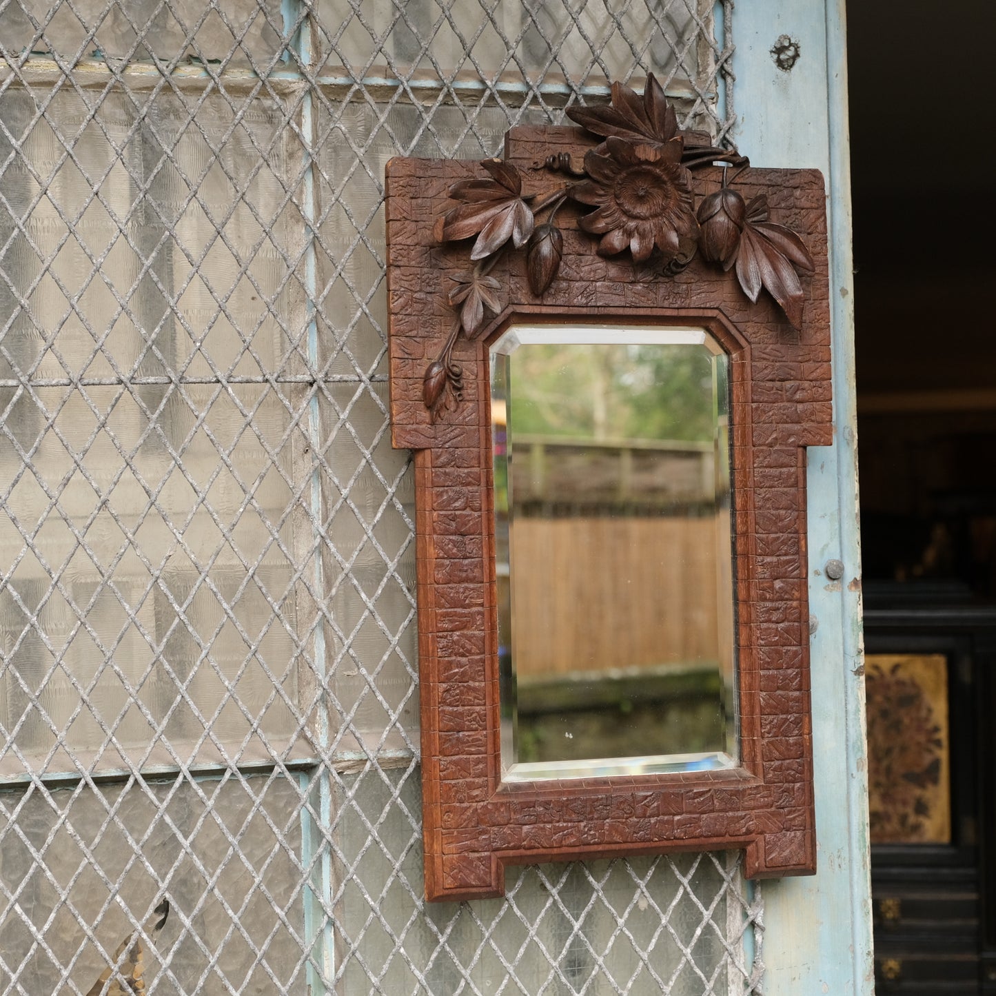 Mirror in Ornately Carved Wooden Frame